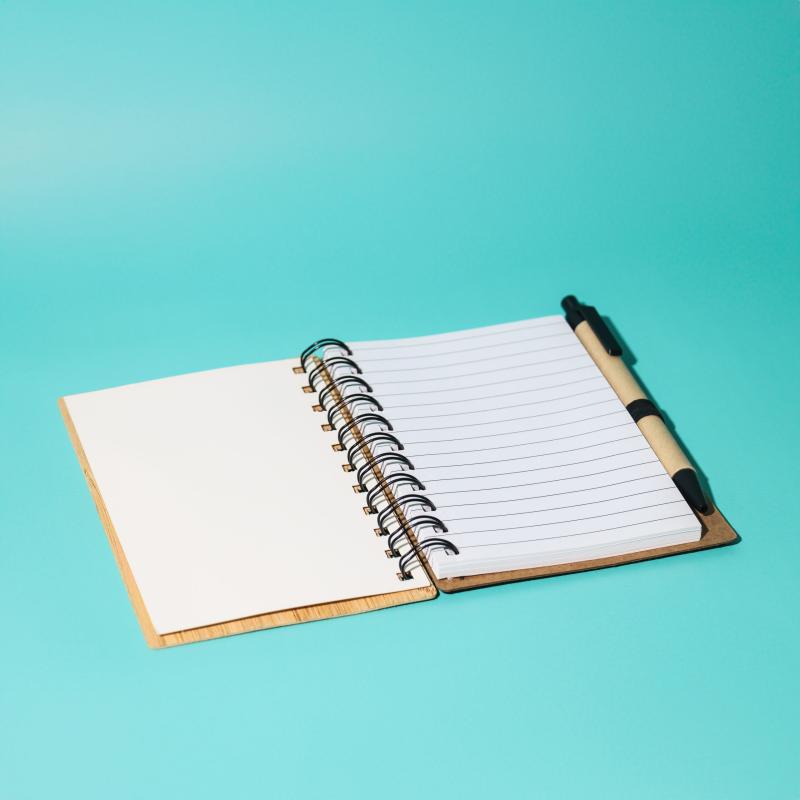 Open notebook with pen